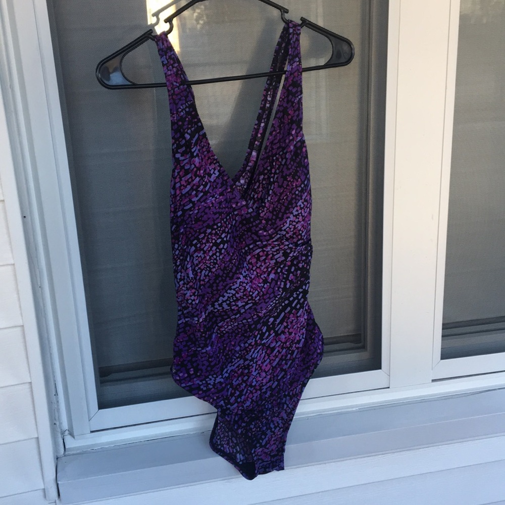 SPEEDO one piece very flattering. Cross cross back